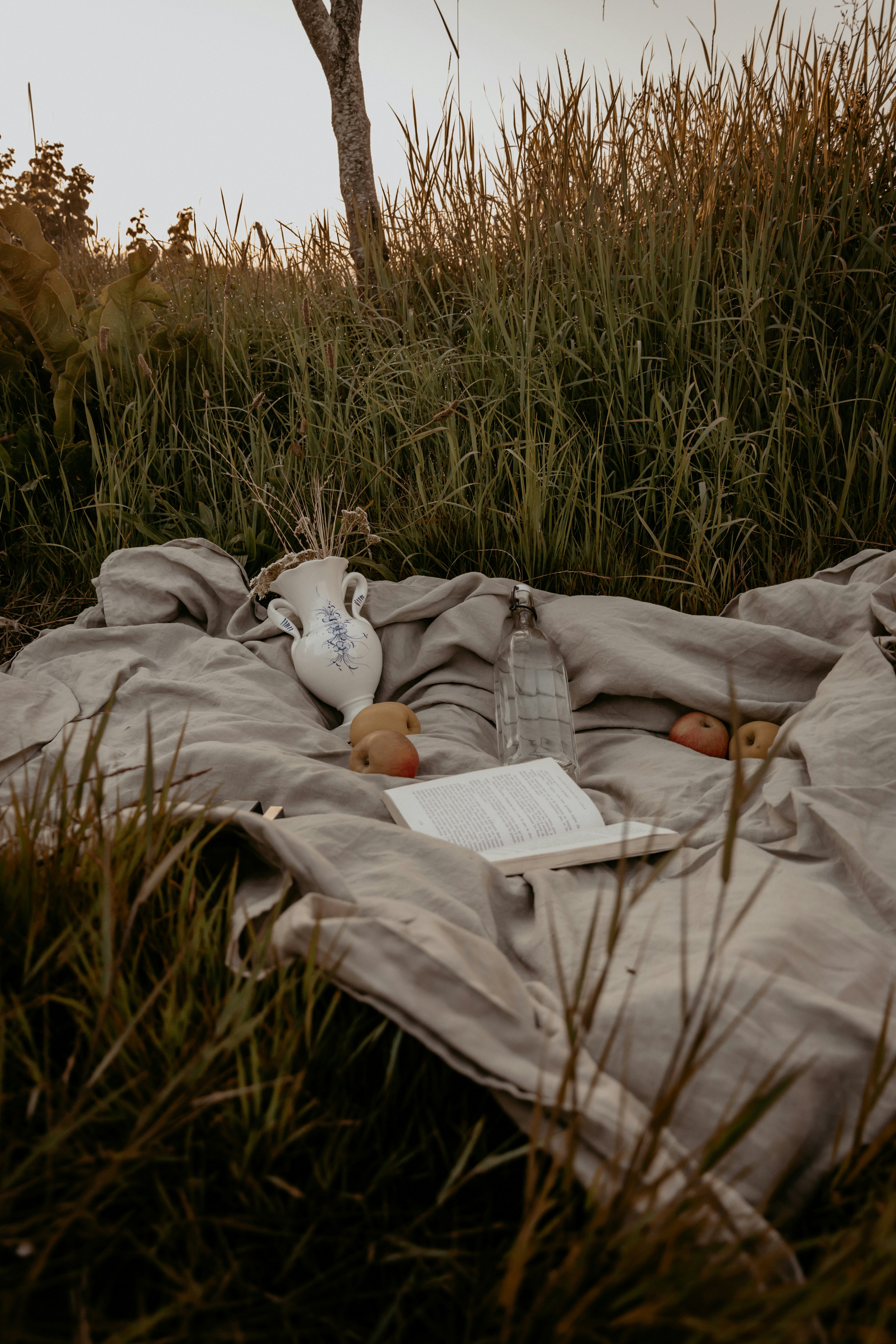 white book on brown textile